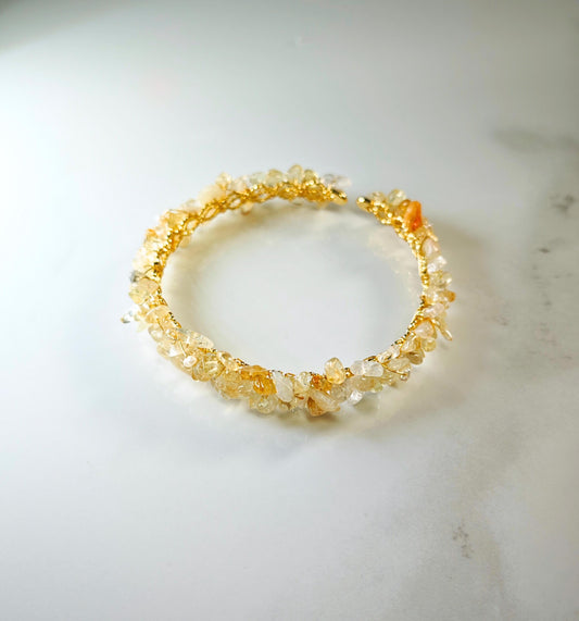 Bracelet with natural stone beads on a light marble surface